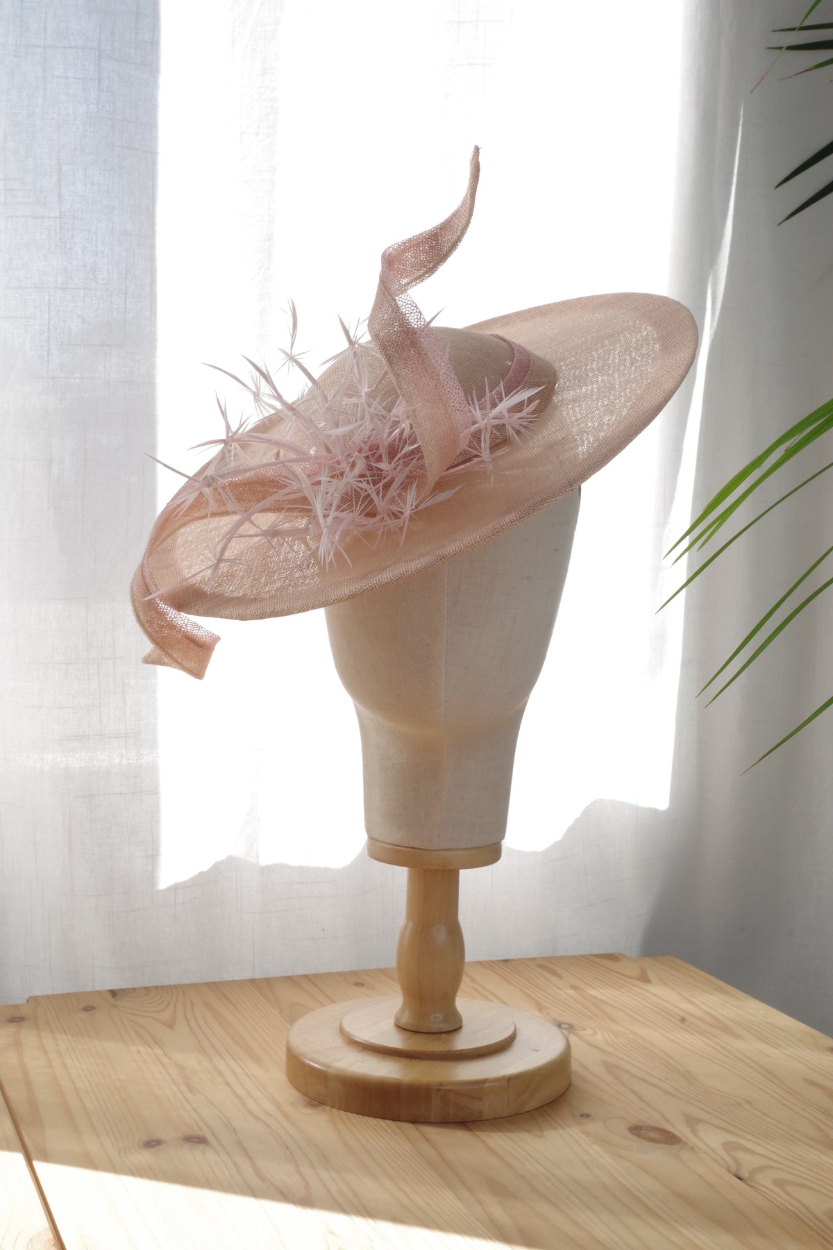 Sand sinamay occasion hat with soft pink trim and feathers by MICHAETT