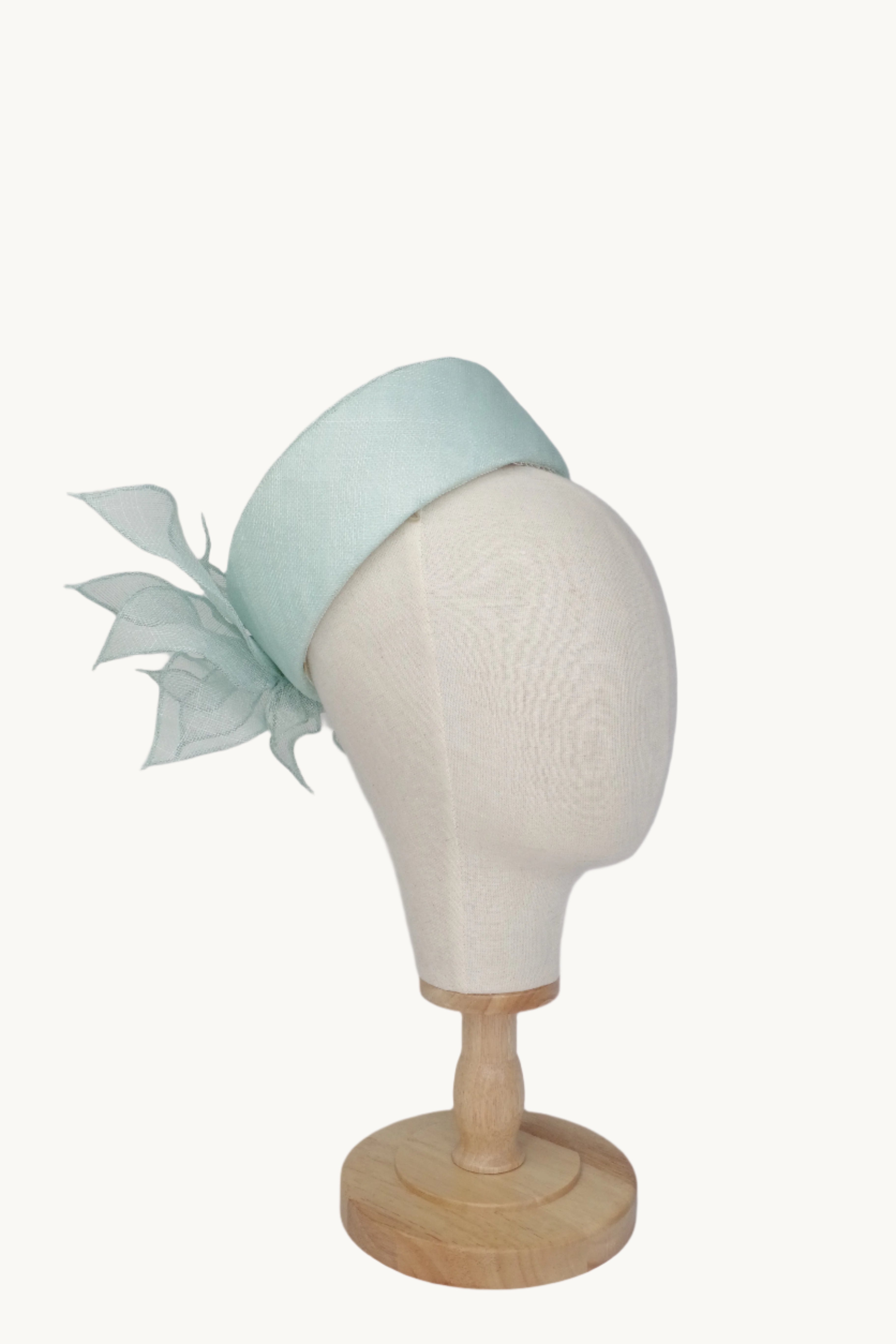 Pill box hat light blue with flower decoration