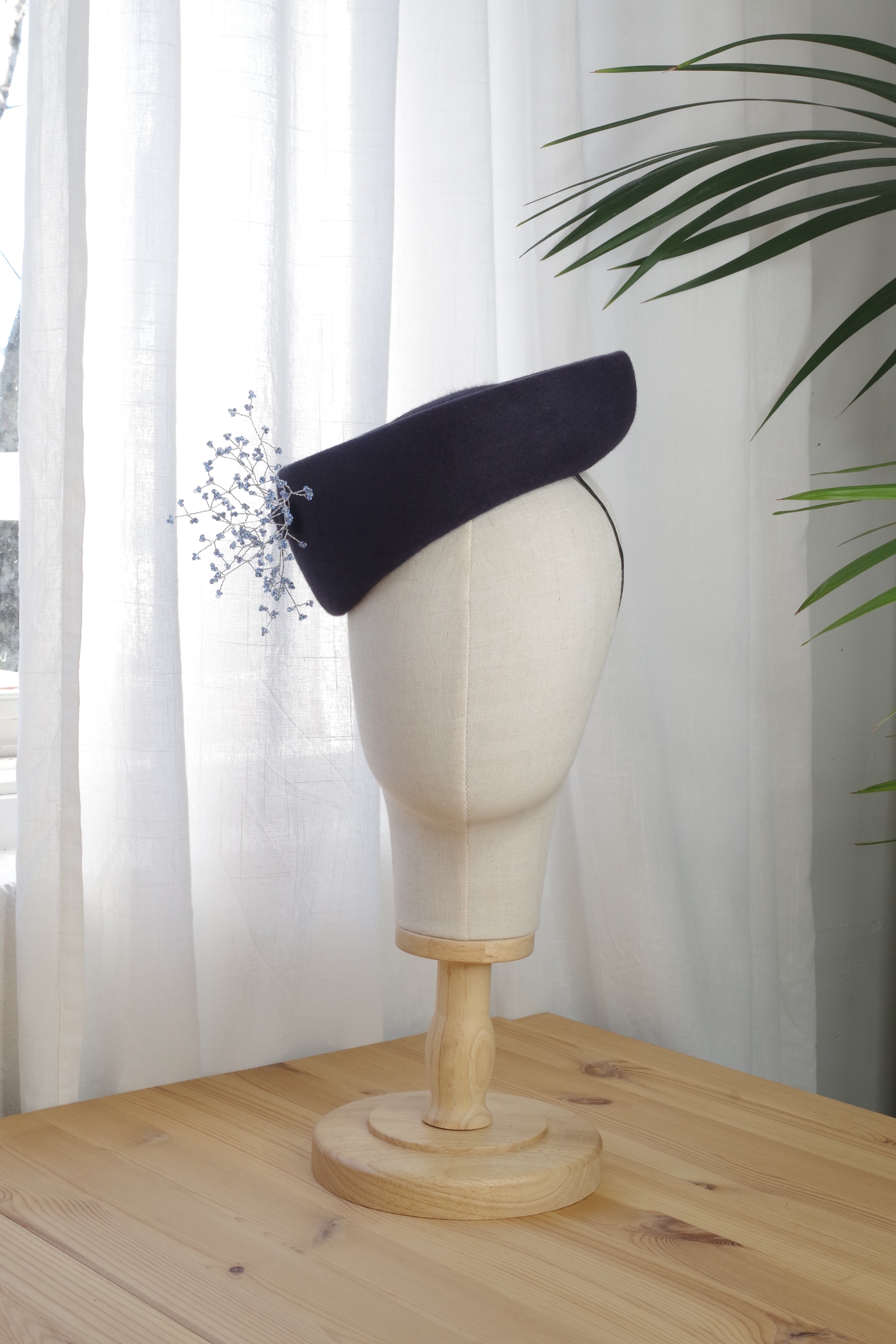 Handcrafted navy fur felt cocktail hat by MICHAETT featuring delicate light blue beaded embellishments.