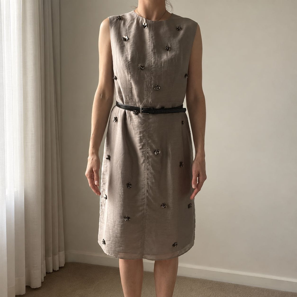 Outfit photo of a sleeveless taupe dress with a black belt, sent for the MICHAETT hat styling service